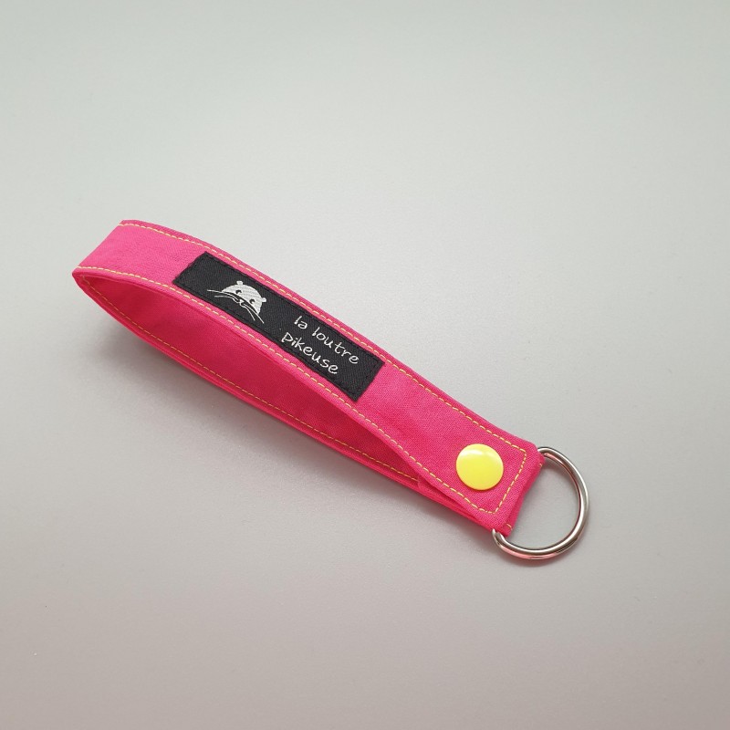 Porte-clés capsule fluo - rose
