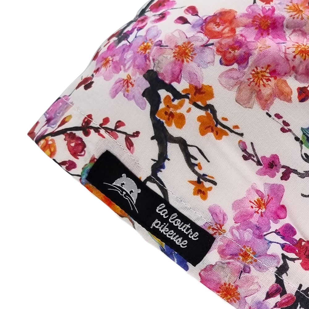 Calot de bloc couvrant fleuri rose avec des petits oiseaux
