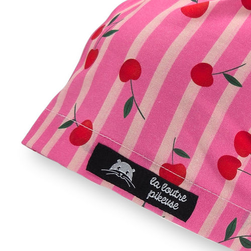 Calot de bloc couvrant avec des cerises rouges et roses