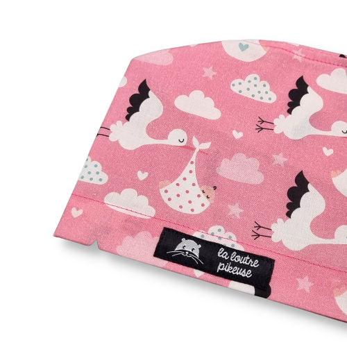 Calot de bloc couvrant avec des cigognes apportant un bébé, rose