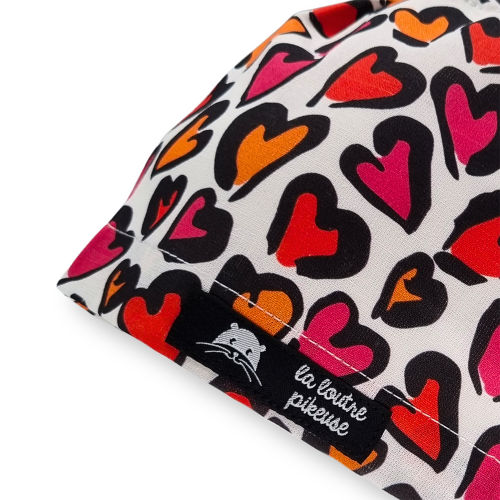 Calot de bloc couvrant motif léopard et coeur rouge et orange