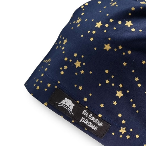 Calot de bloc couvrant avec des étoiles dorées sur fond bleu marine