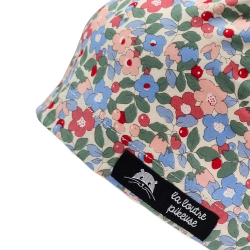 Calot de bloc couvrant avec des fleurs vertes, bleues et rouges