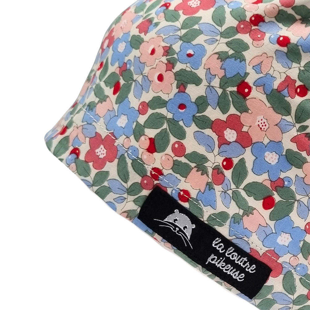 Calot de bloc couvrant avec des fleurs vertes, bleues et rouges