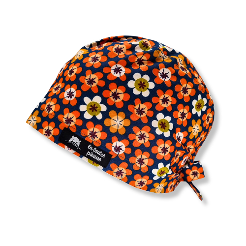 Calot de bloc couvrant avec des grosses fleurs oranges sur fond canard